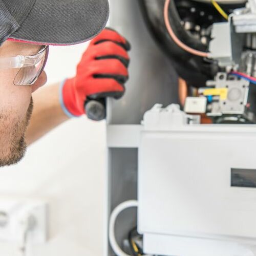 A Technician Checks a Heater.